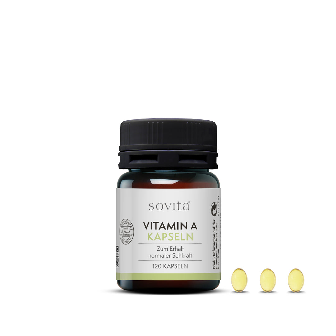 Dose sovita Vitamin A Kapseln mit drei ovalen, gelblichen Kapseln rechts daneben