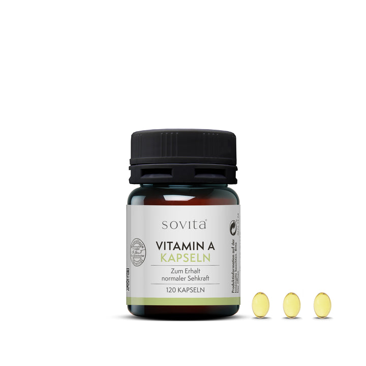 Dose sovita Vitamin A Kapseln mit drei ovalen, gelblichen Kapseln rechts daneben